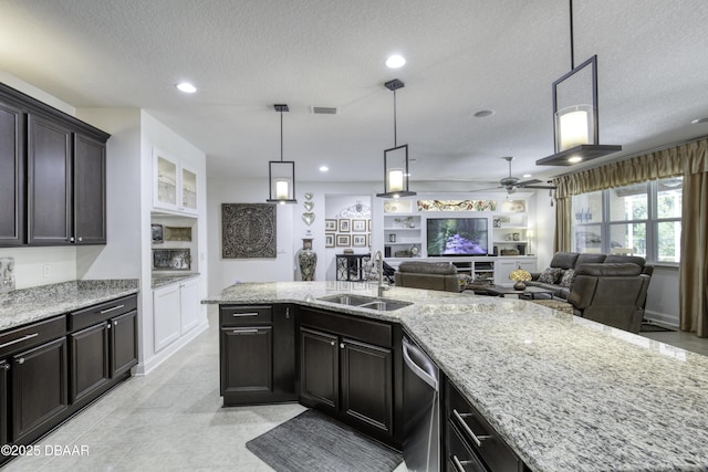 47 Abacus Ave, Ormond Beach, FL 32174 - kitchen with a sink, a textured ceiling, light stone counters, a ceiling fan, and stainless steel dishwasher