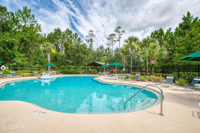 47 Abacus Ave, Ormond Beach, FL 32174 - community pool featuring a patio area and view of scattered trees