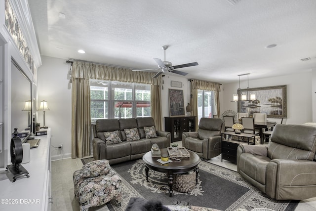 47 Abacus Ave, Ormond Beach, FL 32174 - living room featuring ceiling fan, a textured ceiling, recessed lighting, and baseboards