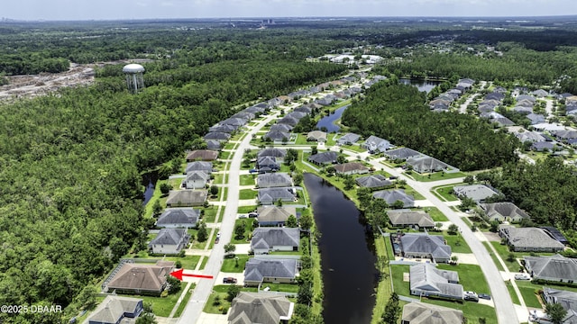 47 Abacus Ave, Ormond Beach, FL 32174 - aerial view of property and surrounding area with a heavily wooded area, a large body of water, and nearby suburban area