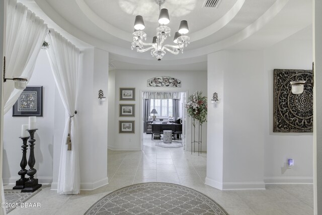 47 Abacus Ave, Ormond Beach, FL 32174 - hall with light tile patterned floors, a chandelier, and baseboards