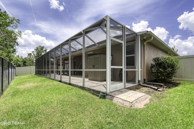 47 Abacus Ave, Ormond Beach, FL 32174 - rear view of property featuring glass enclosure, stucco siding, and a patio
