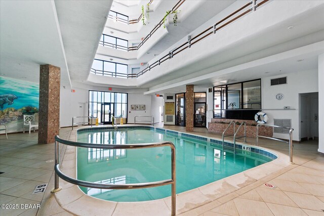 community pool featuring a skylight