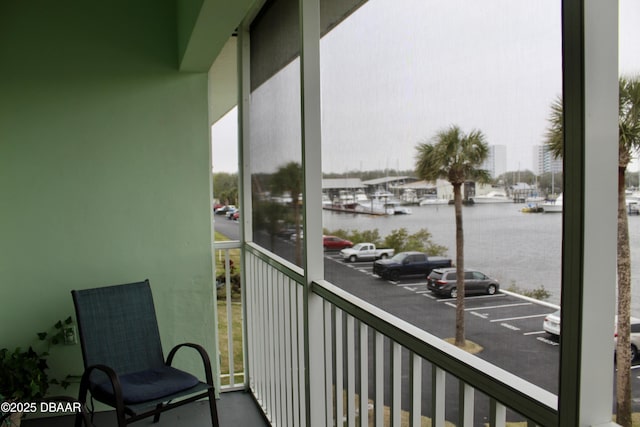 balcony featuring a water view