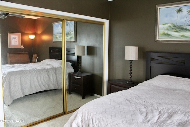 bedroom with carpet and a closet