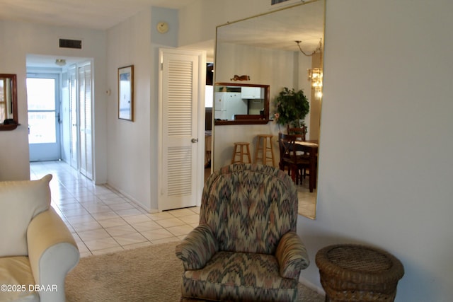 hallway with light tile patterned floors