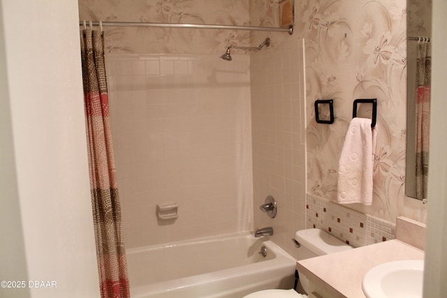 full bathroom with shower / bathtub combination with curtain, vanity, and toilet