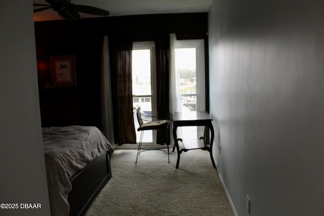 bedroom with ceiling fan and light carpet