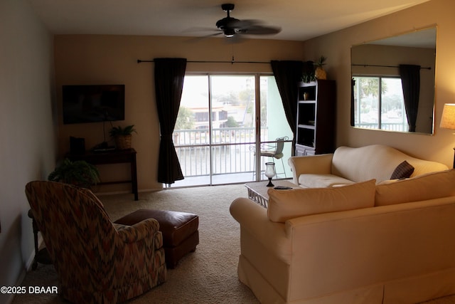 living room featuring ceiling fan and light colored carpet