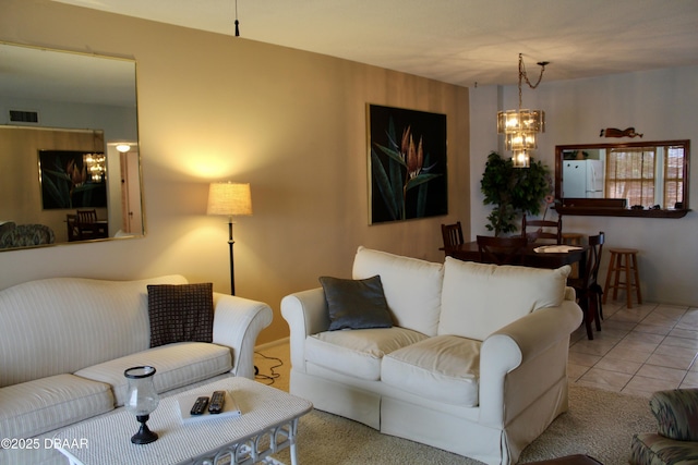 tiled living room featuring a chandelier