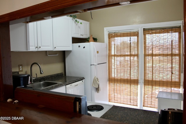 kitchen featuring white cabinetry, white dishwasher, and sink