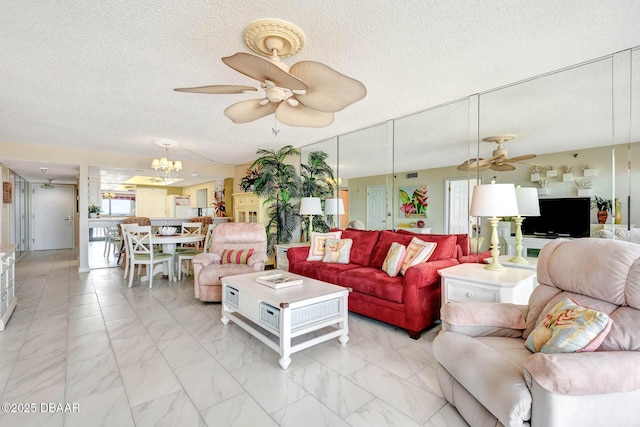 2425 S Atlantic Ave Unit 202, Daytona Beach, FL 32118 - living room with a ceiling fan, light marble finish flooring, a textured ceiling, and a chandelier