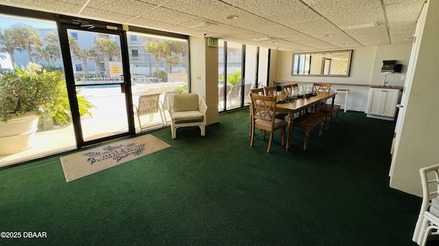 2425 S Atlantic Ave Unit 202, Daytona Beach, FL 32118 - dining room with dark colored carpet and a drop ceiling