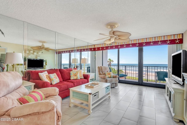 2425 S Atlantic Ave Unit 202, Daytona Beach, FL 32118 - living area with a ceiling fan and a textured ceiling