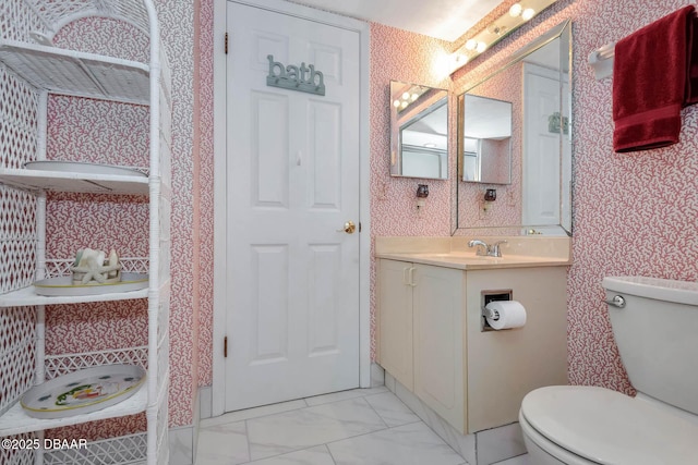 2425 S Atlantic Ave Unit 202, Daytona Beach, FL 32118 - bathroom featuring vanity, wallpapered walls, and marble look tile flooring