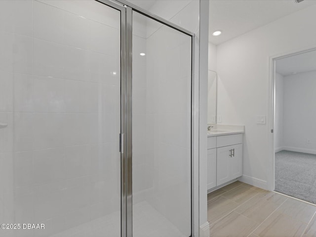 bathroom with vanity and an enclosed shower