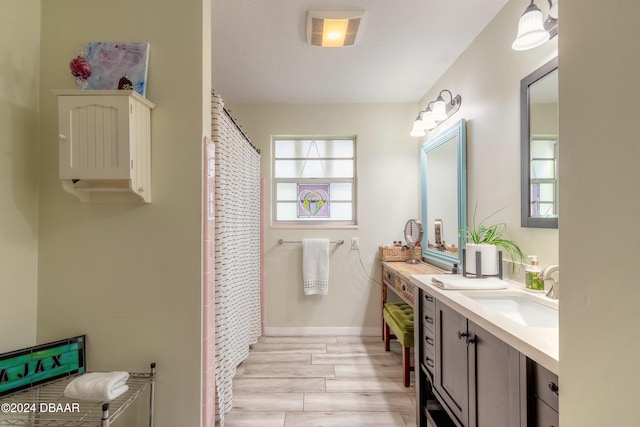 bathroom featuring vanity and hardwood / wood-style flooring