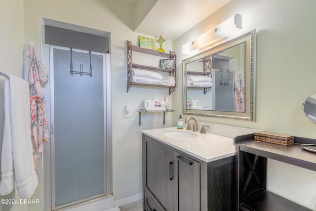 bathroom featuring an enclosed shower and vanity