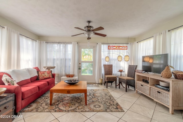 tiled living room with ceiling fan