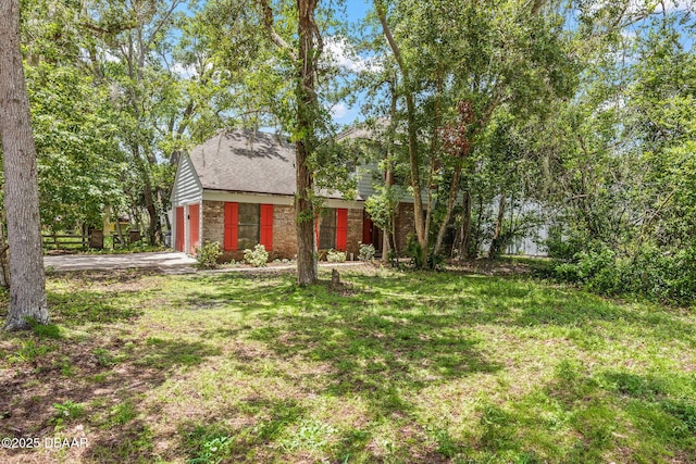 4 Eagle Rock Trl, Ormond Beach, FL 32174 - view of grassy yard featuring driveway