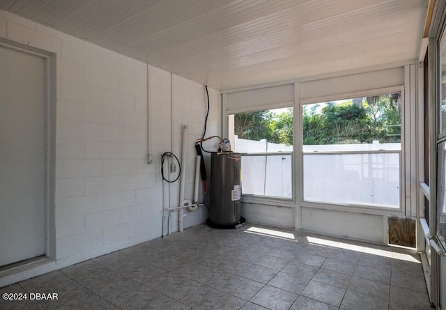 unfurnished sunroom with water heater