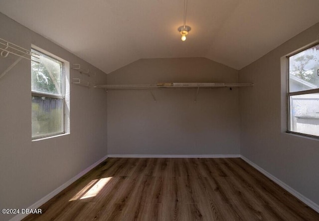 bonus room featuring dark hardwood / wood-style floors and lofted ceiling