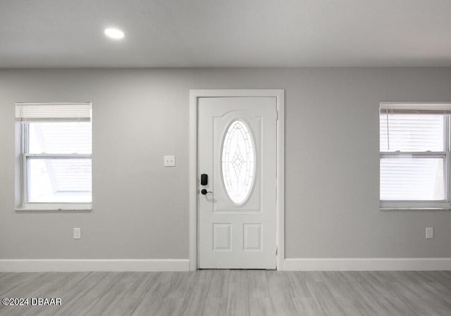 entrance foyer with light wood-type flooring and plenty of natural light