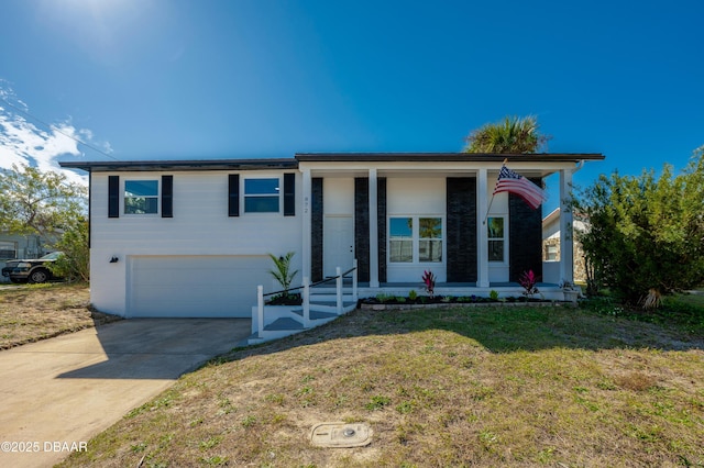 view of front of home featuring a garage and a front lawn