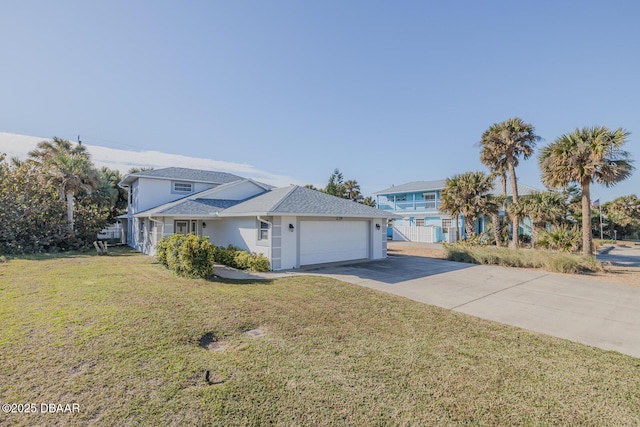 view of front of property with a garage and a front yard