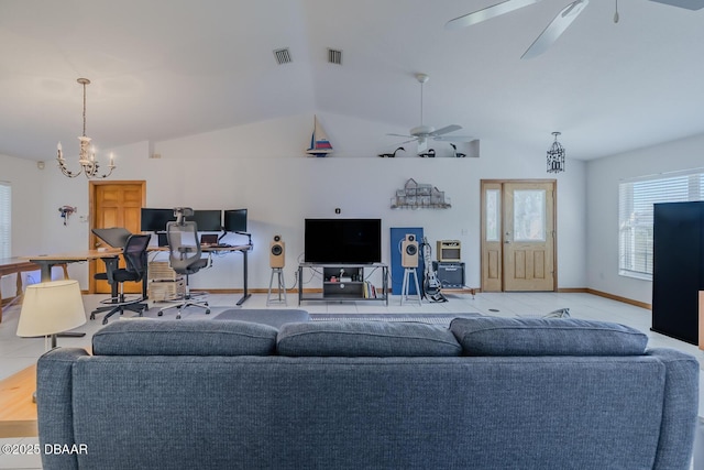 living room featuring lofted ceiling, light tile patterned floors, and ceiling fan with notable chandelier