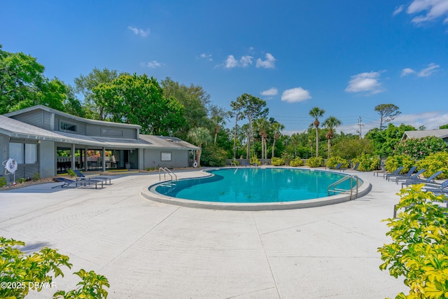 view of swimming pool featuring a patio area