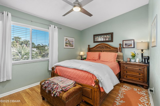 bedroom featuring wood-type flooring, lofted ceiling, and ceiling fan