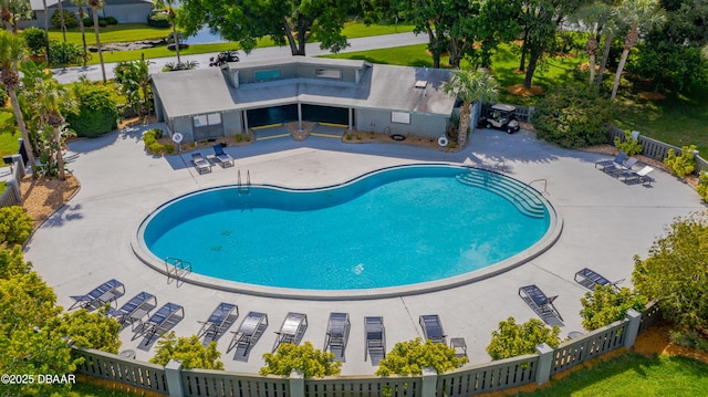 view of swimming pool with a patio area