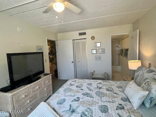 3800 S Atlantic Ave Unit 502, Daytona Beach, FL 32118 - bedroom featuring a closet, a textured ceiling, ceiling fan, and connected bathroom