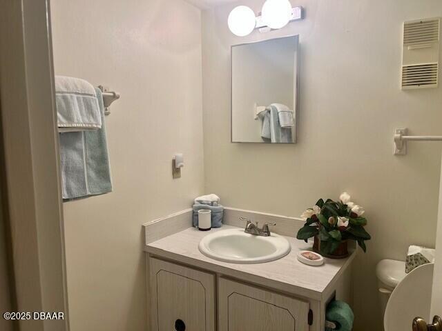 3800 S Atlantic Ave Unit 502, Daytona Beach, FL 32118 - half bath with toilet and vanity