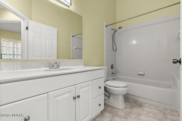 full bathroom with vanity, tile patterned floors, toilet, and washtub / shower combination