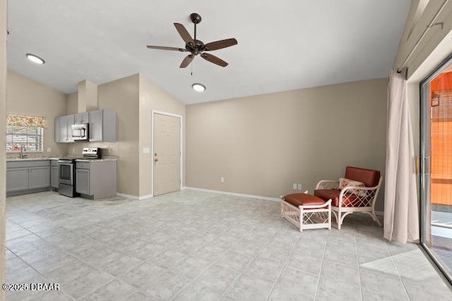 unfurnished room featuring lofted ceiling and ceiling fan