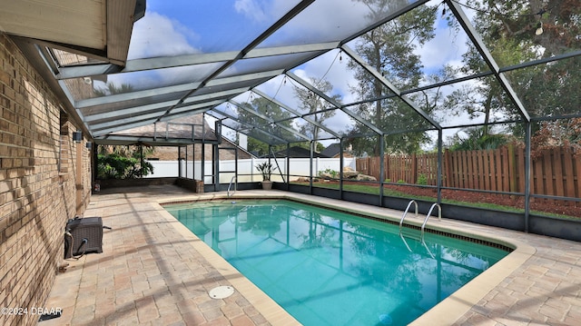 view of pool featuring a lanai and a patio