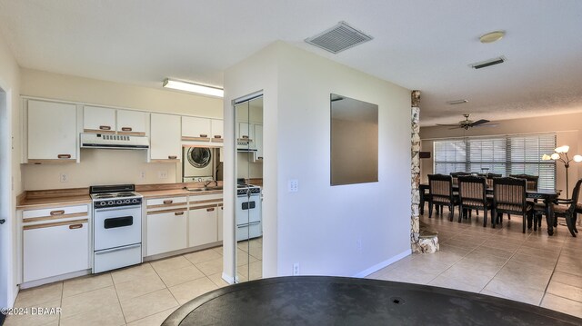 kitchen featuring white stove, white cabinets, ceiling fan, and sink