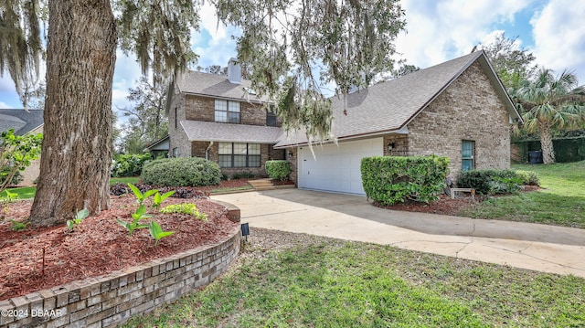 view of front facade featuring a front yard and a garage