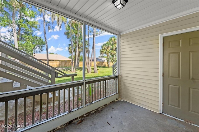 unfurnished sunroom featuring a healthy amount of sunlight