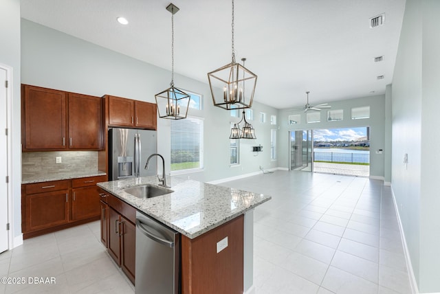 113 Azure Mist Way, Daytona Beach, FL 32124 - kitchen with a sink, stainless steel appliances, open floor plan, tasteful backsplash, and ceiling fan