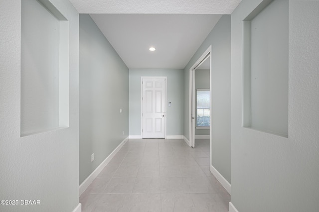 113 Azure Mist Way, Daytona Beach, FL 32124 - hallway featuring light tile patterned floors and baseboards