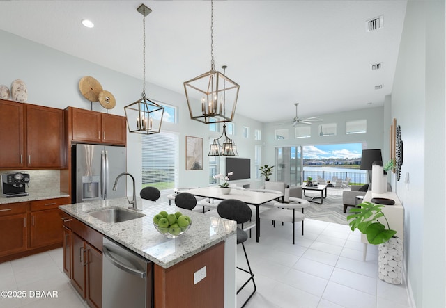 113 Azure Mist Way, Daytona Beach, FL 32124 - kitchen with stainless steel appliances, a sink, an island with sink, plenty of natural light, and recessed lighting