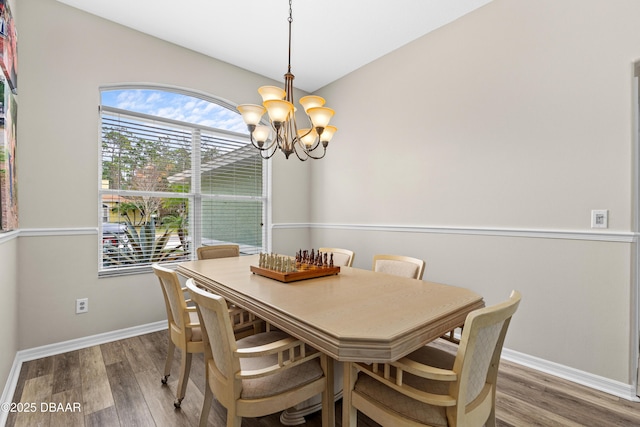 dining room featuring a chandelier and hardwood / wood-style floors