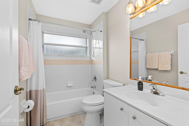 bathroom featuring toilet, visible vents, shower / bath combo with shower curtain, and vanity