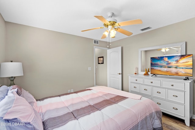 bedroom featuring wood-type flooring and ceiling fan