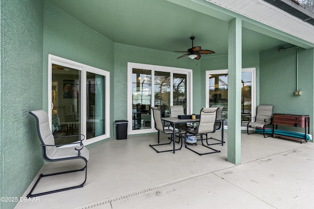 view of patio with ceiling fan and outdoor dining space