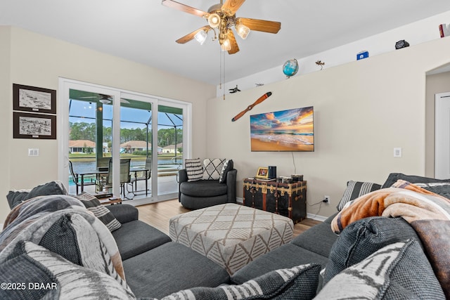 living room featuring hardwood / wood-style flooring and ceiling fan