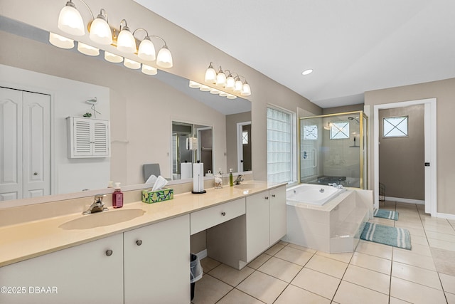 bathroom featuring tile patterned flooring, shower with separate bathtub, vaulted ceiling, and vanity